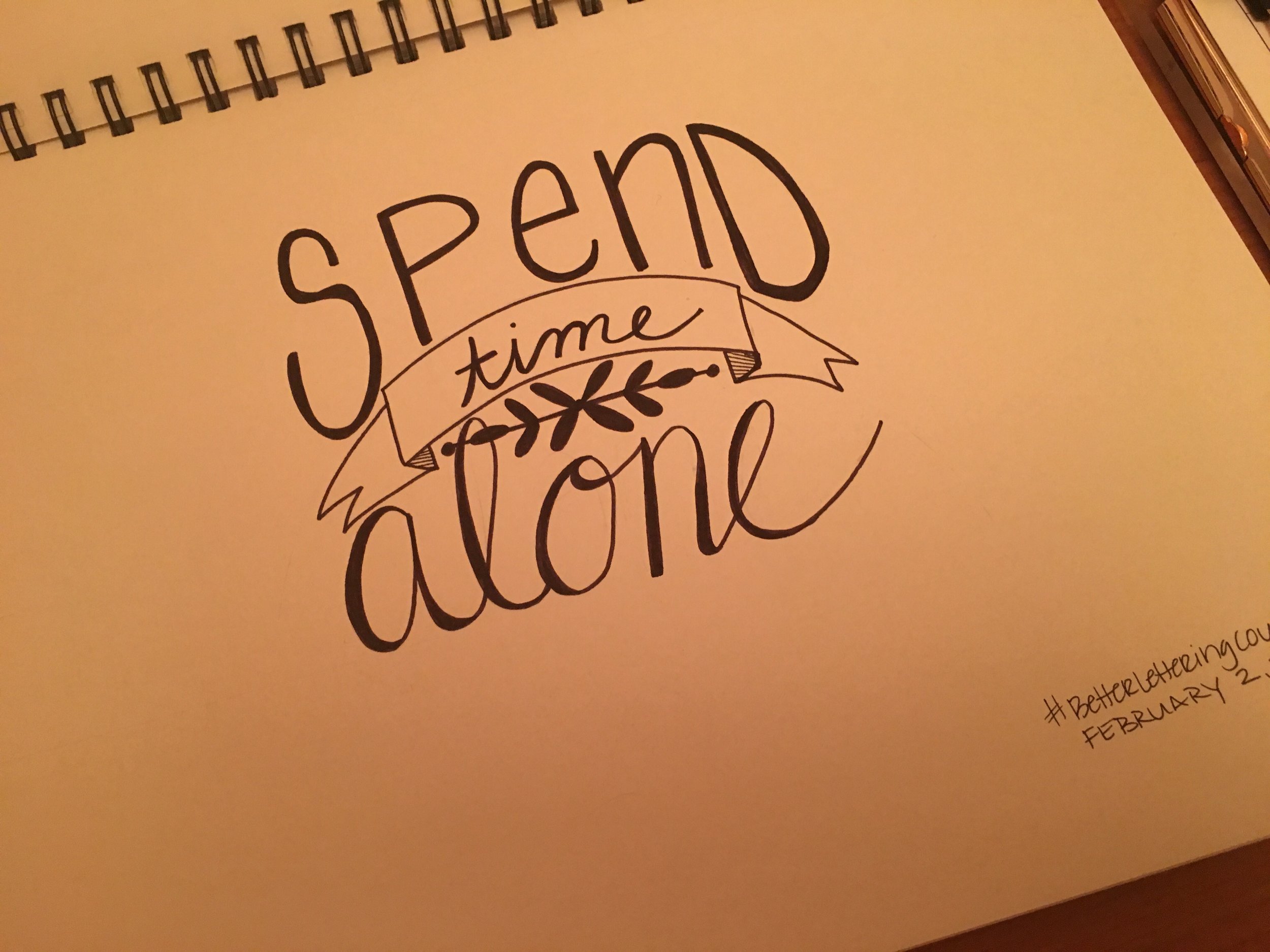 hand lettering by emily reeves dean that says spend time alone