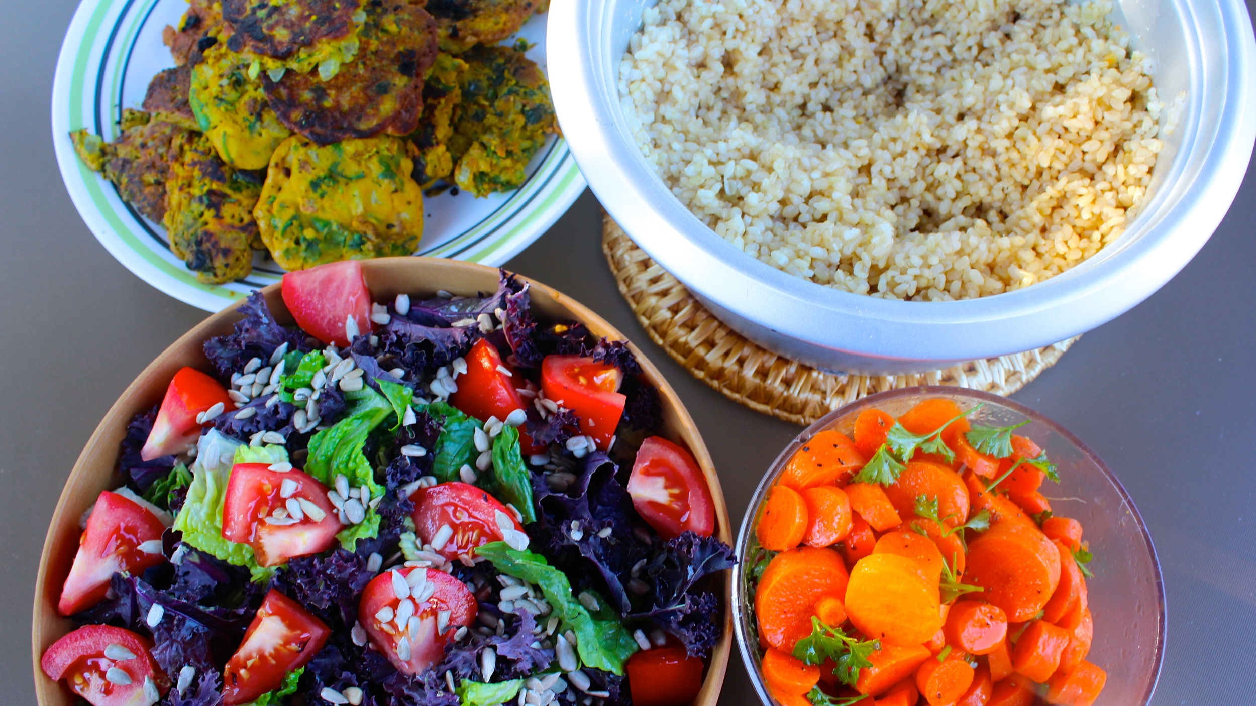 Chickpea patties, brown rice, and salads