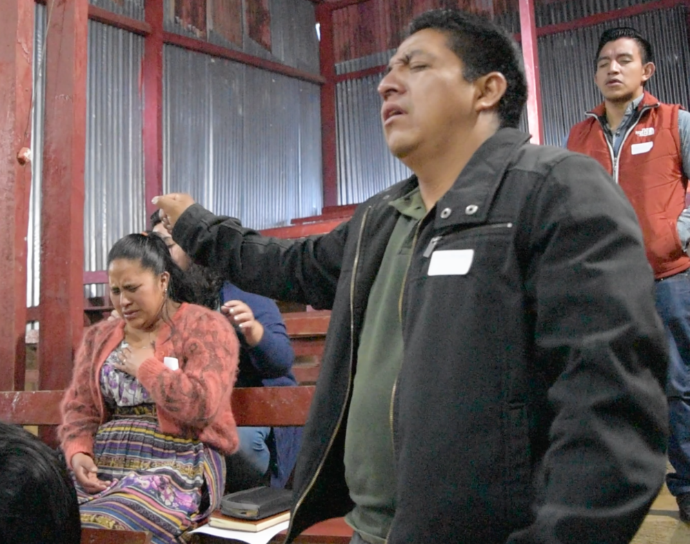  Sandra and Carlos Enrique worshiping Jesus at a Church Mobilization conference. 