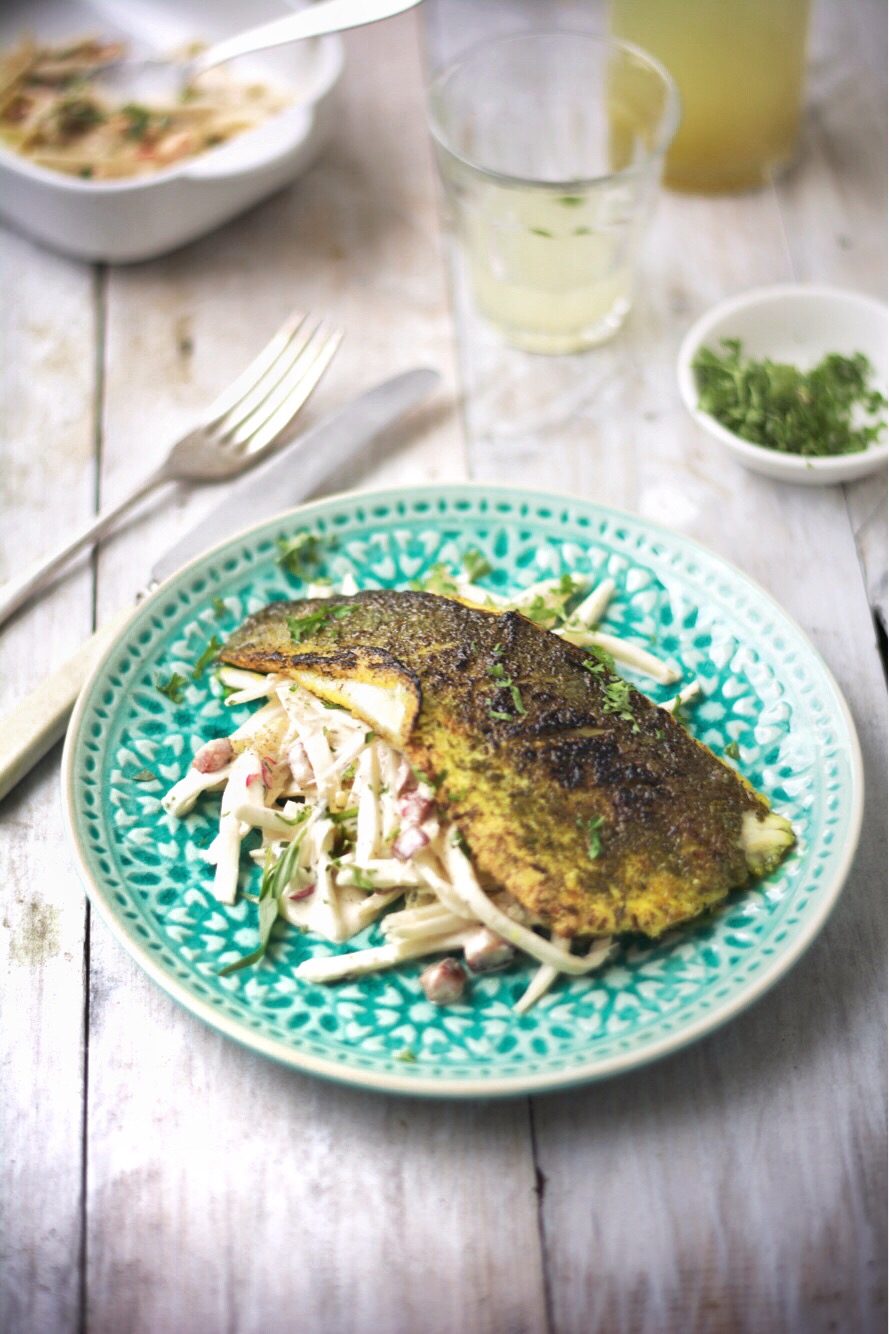 Sea bass fillet, rubbed in turmeric, herb salt and seaweed, with celeriac, chilli and carrot remoulade 