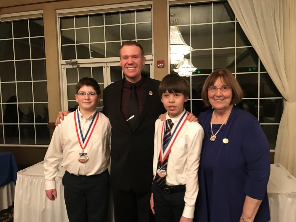 Jeff Veley meets with Dr. Louise Chickie Wolfe and students who were honored for their community service project and bullying prevention efforts.