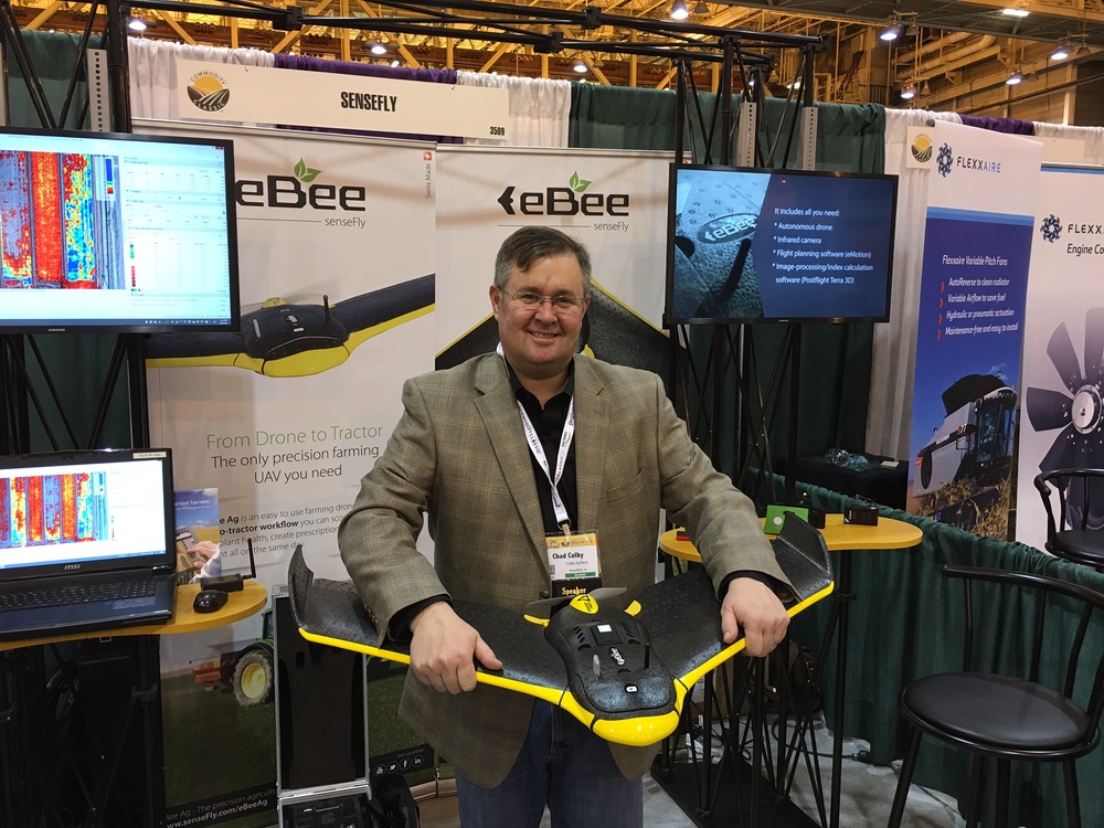 Holding eBee w/ integrated Parrot Sequoia sensor at 2016 Commodity Classic, March 2016.
