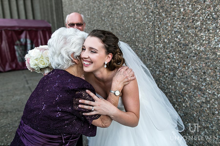 nac-rooftop-terrace-wedding-bride-hugging-grandma-after-ceremony