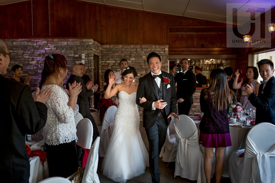 bride and groom entering reception hall at strathmere wedding Ottawa