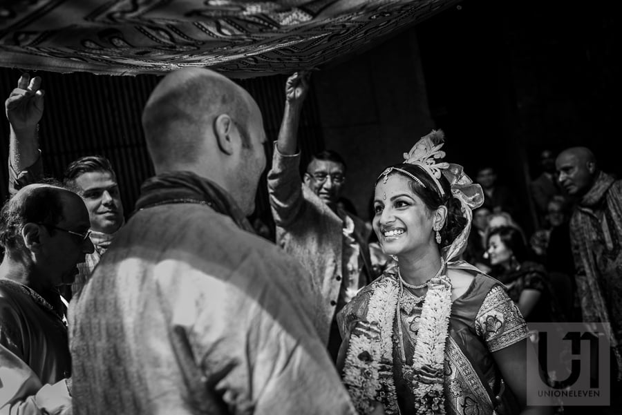 bride looking at groom adoringly during Hindu wedding ceremony