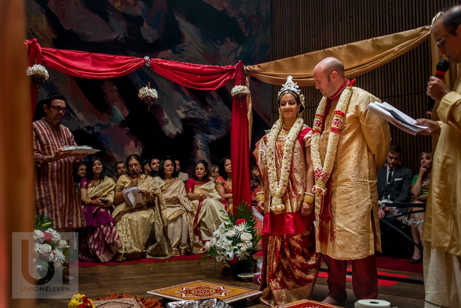 bride and groom standing during traditional Hindu wedding ceremony at the National Arts Centre in Ottawa