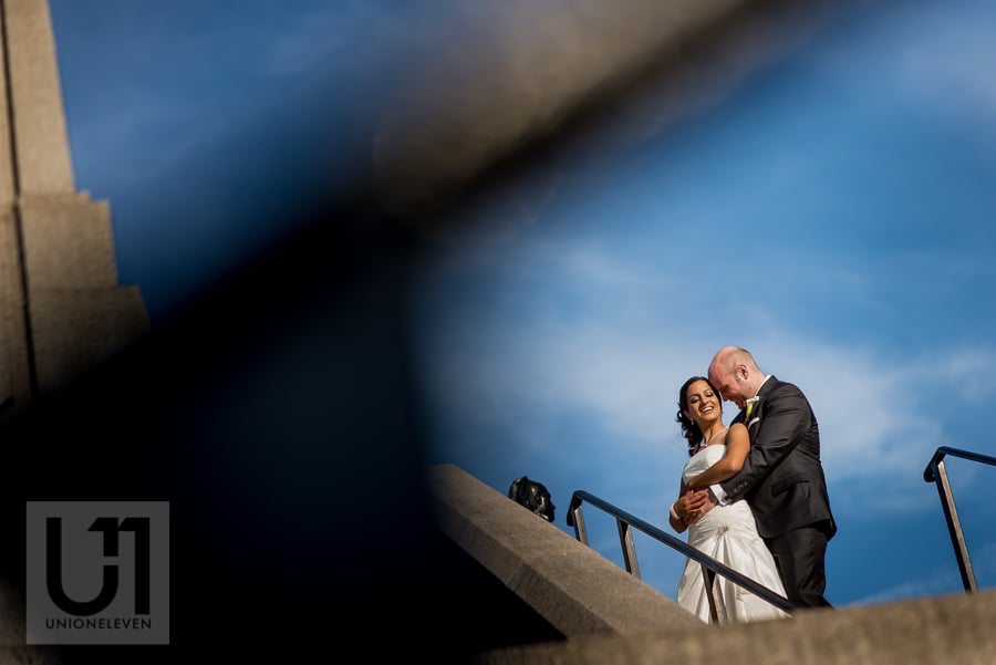 portrait of groom holding bride from behind in downtown Ottawa
