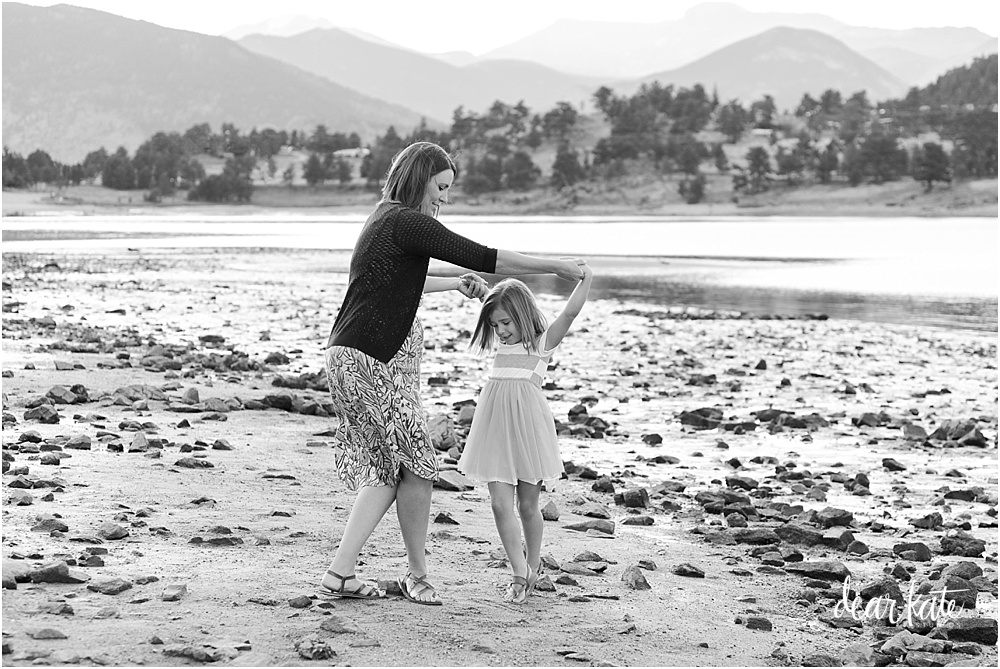 dancing mother and daughter on beach of mary's lake estes park Colorado