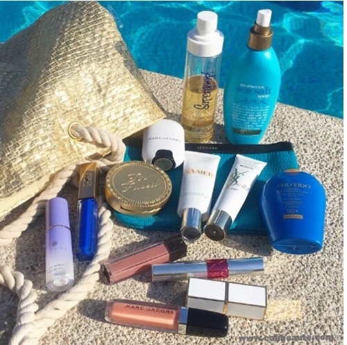 Pool side essentials include the Supergoop Sunscreen Oil. 