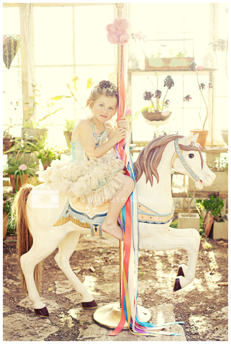 Childrens Portrait on Carousel Horse by The Suitcase Studio