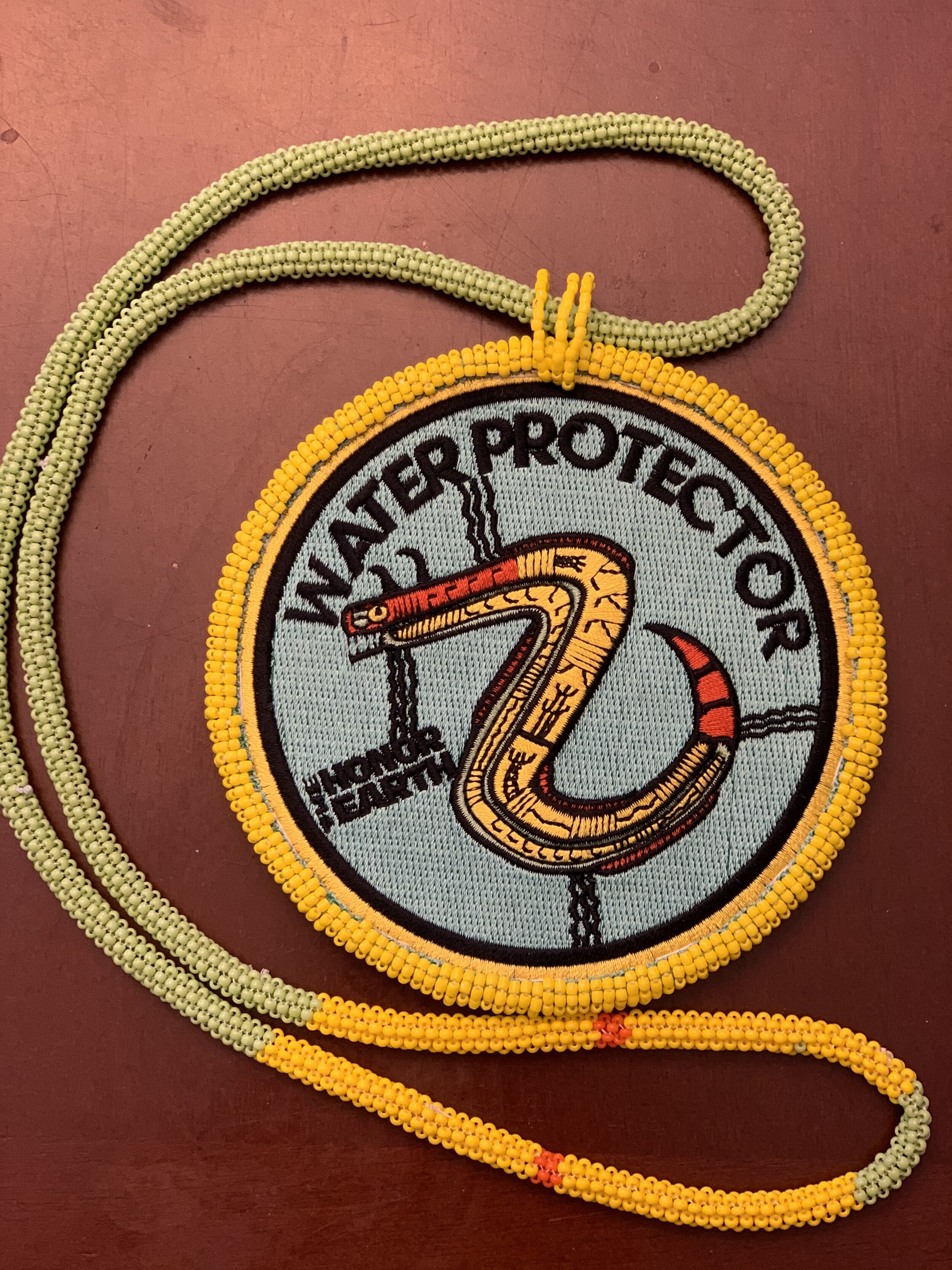Defeating the Black Snake Water Protector Authentic Native Custom Beaded  Medallion (Yellow #6) — Welcome to Honor The Earth Merchandise Store