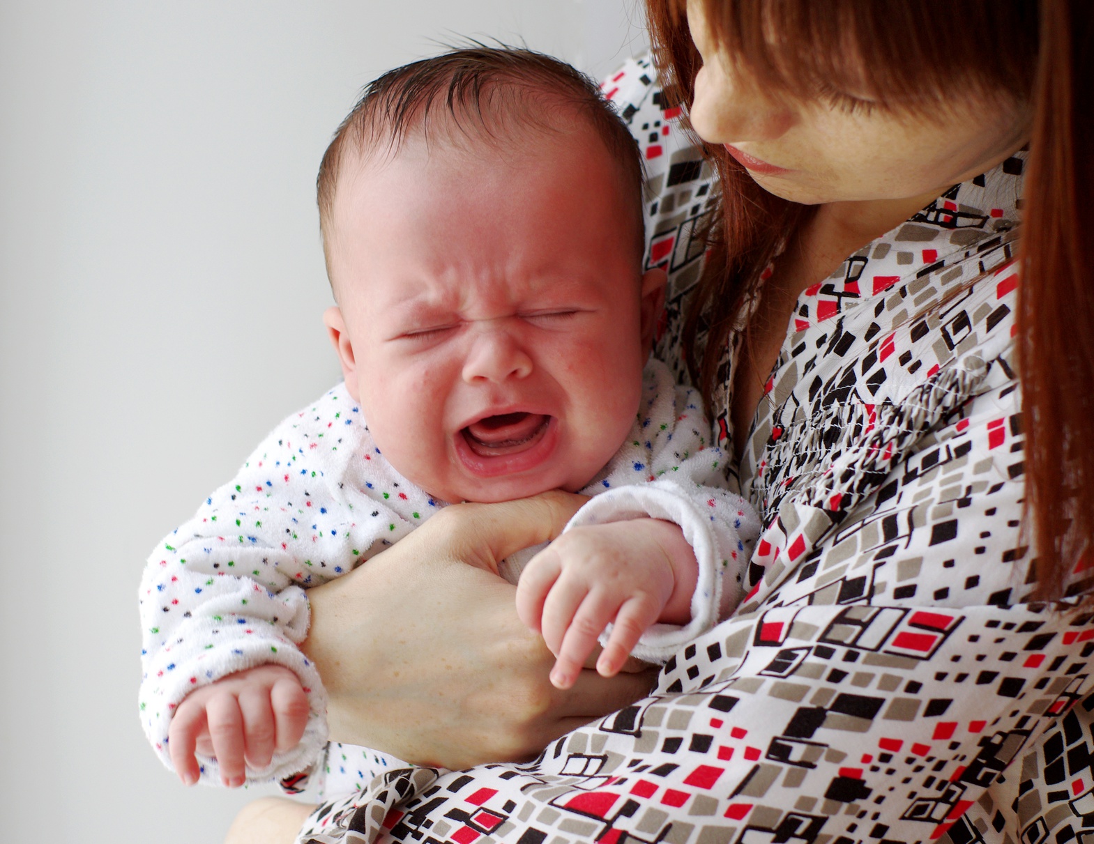 baby keeps crying while nursing