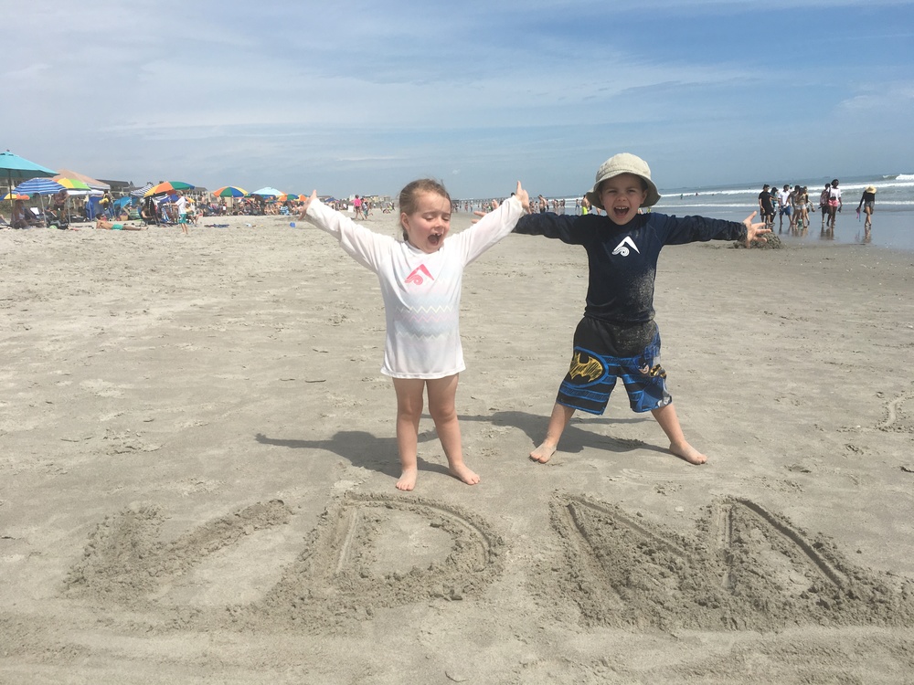 Cade and Evie living it up at Cocoa Beach!  The warm sun.  The blue sky.  Sigh...