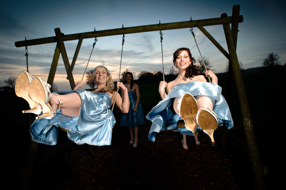 Bridesmaids on the swings at Eastwell Manor