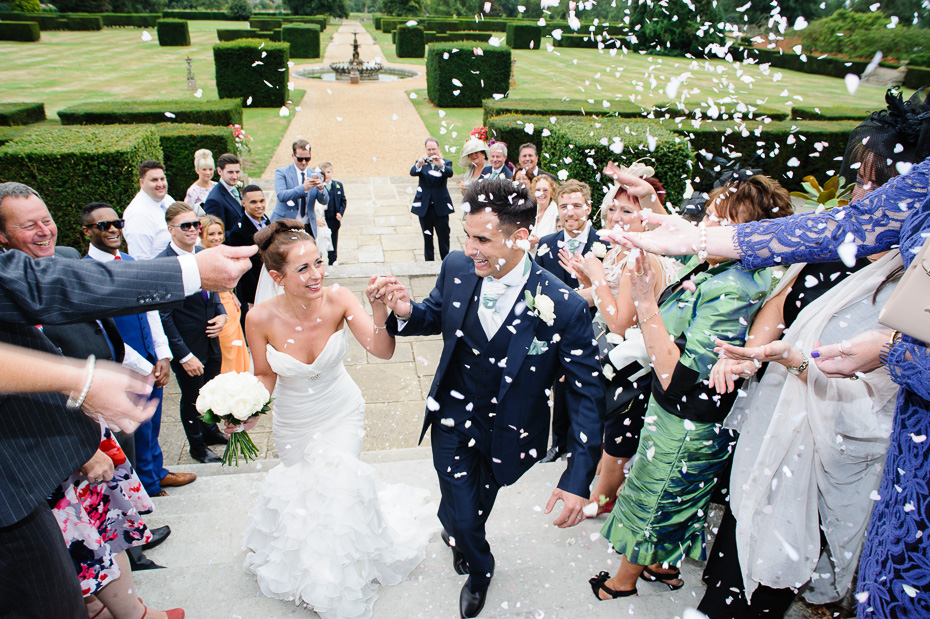 Confetti - Bride and Groom at Eastwell Manor - Kent Wedding Photography