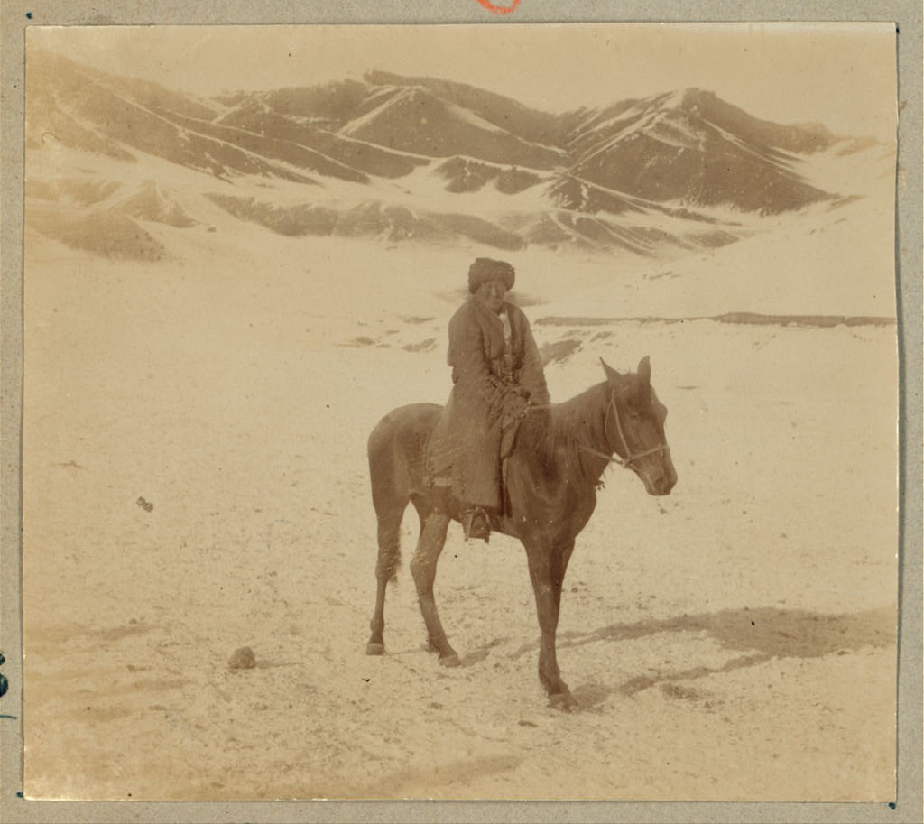 "Bashkir" Man seated on a horse on the outskirts of Samarkand - ice cold wind off the mountains.