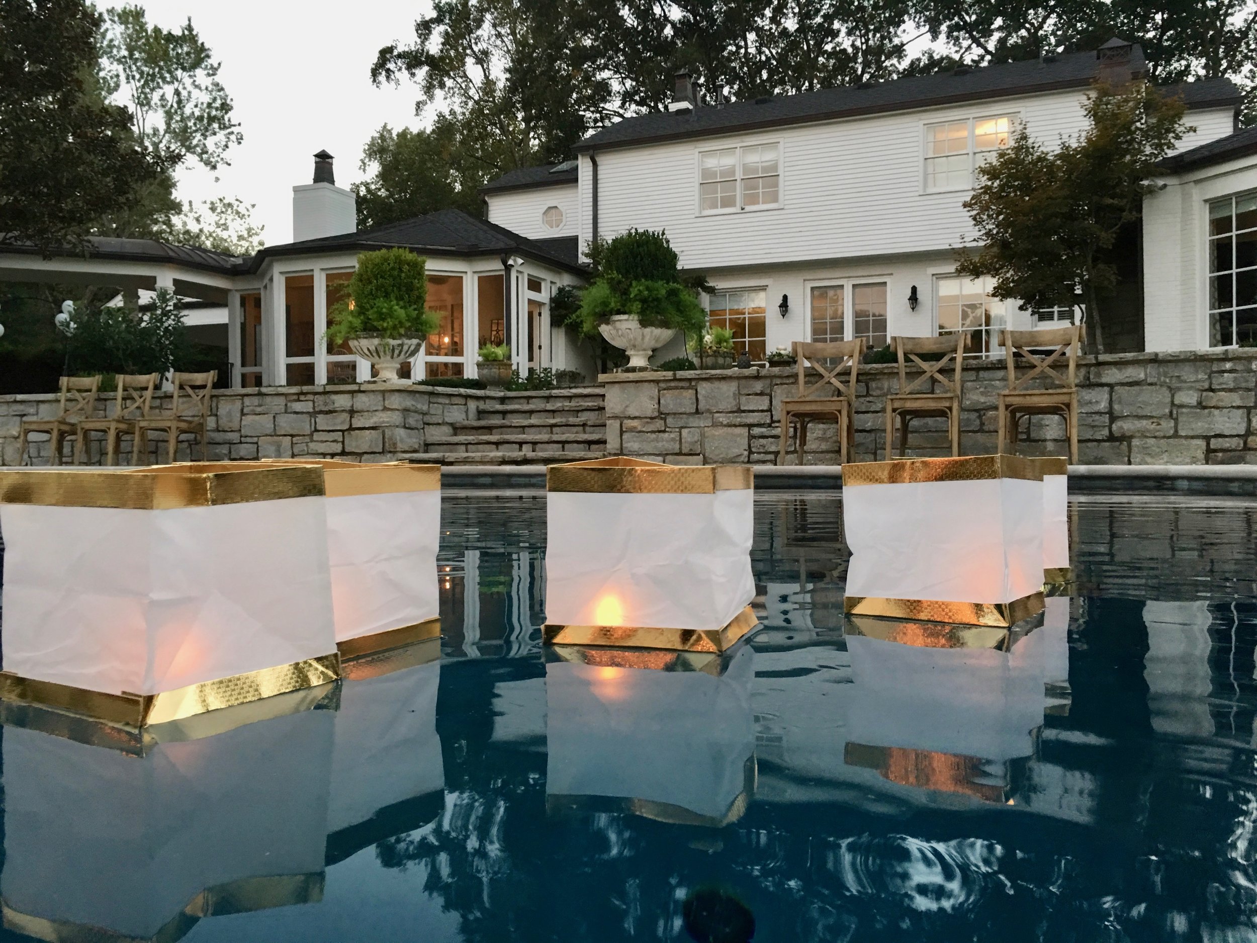  White and Gold Floating lanterns in Pool 