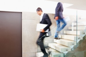 Business colleagues walking on flight of stairs