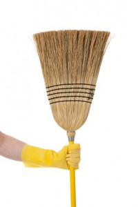 Hand holding Broom - Chore or housework theme