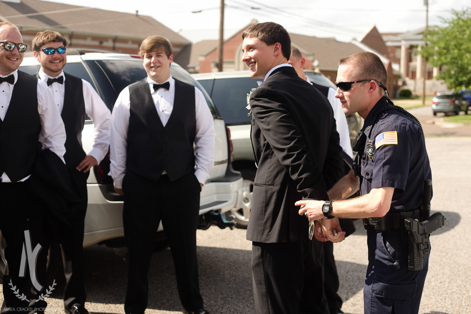 Some of the groomsmen arranged a little "arrest" of the groom..