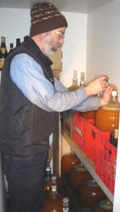 It's cold in the cold room. Wade checks on how fermentation is progressing.