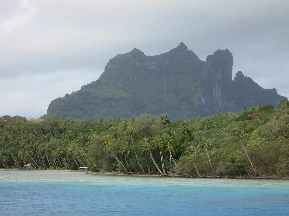 Arriving in Bora Bora with the first few glimpses of Otemanu.  Surprisingly, Otemanu has never been climbed - the rock is extremely poor quality (crumbly) and will not hold any climbing protection.