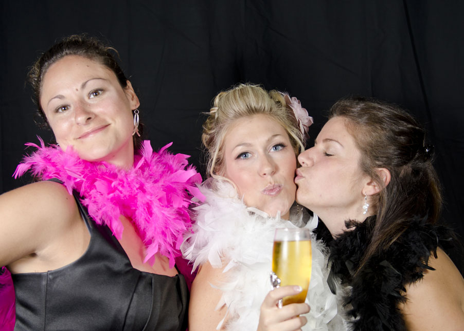 bride and guests at wedding in photobooth at Lago Bar and Grill