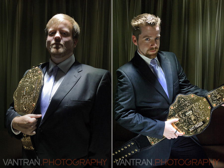 groomsman holding WWE championship belts inside Westin Hotel wedding