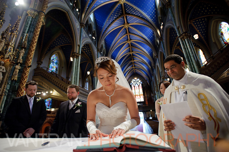 bride signing in notre-dame cathedral basilica