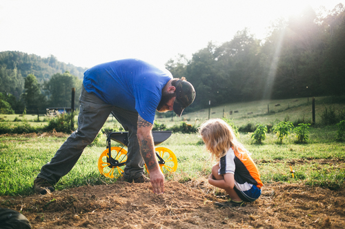 Harvesting_Liberty_Donnie-Hedden-36-Michael-Lewis-with-his-son-Roscoe-he-plants-roots-once-again-with-a-renewed-sense-of-purpose-and-pride.jpg