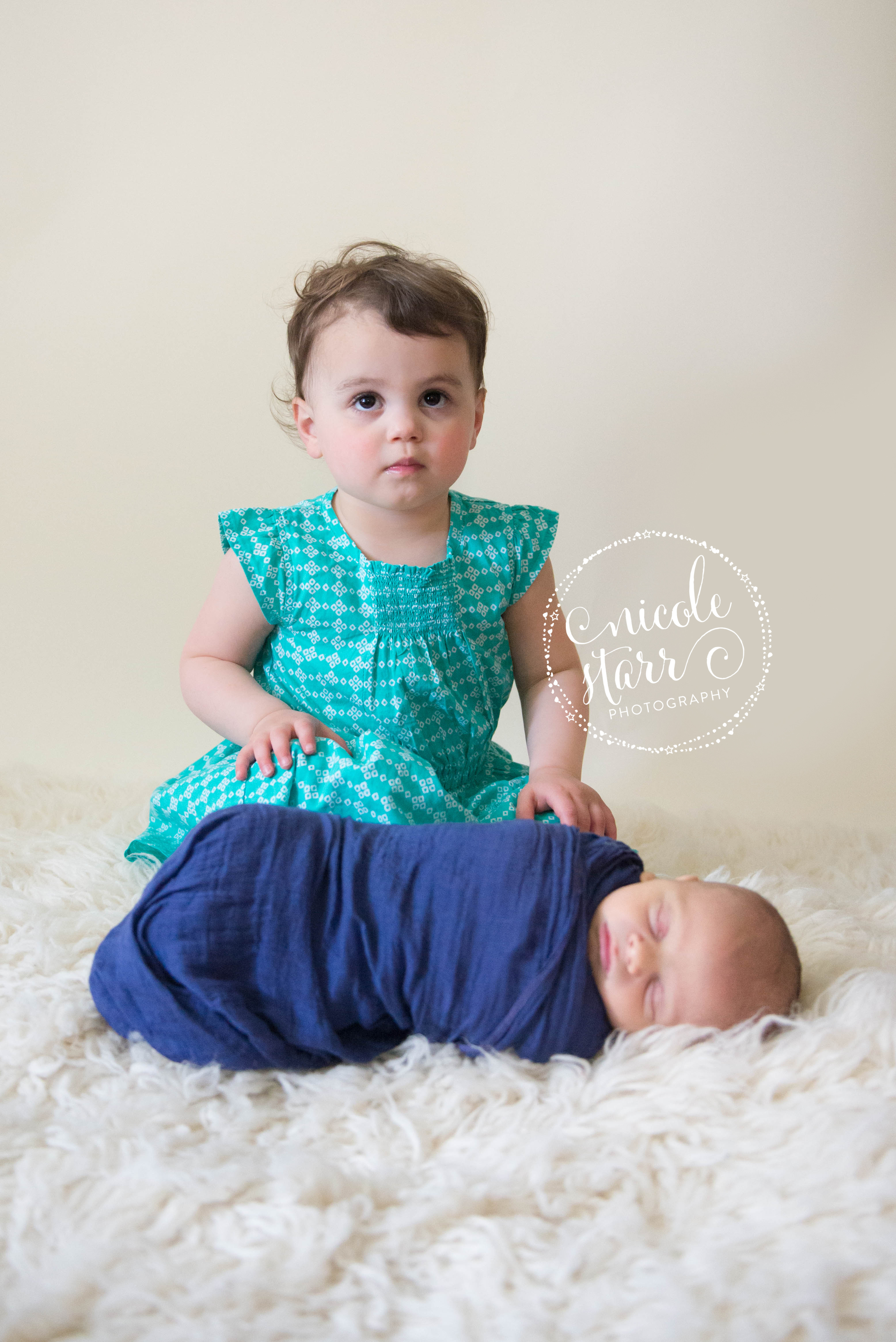 newborn with toddler sister photo