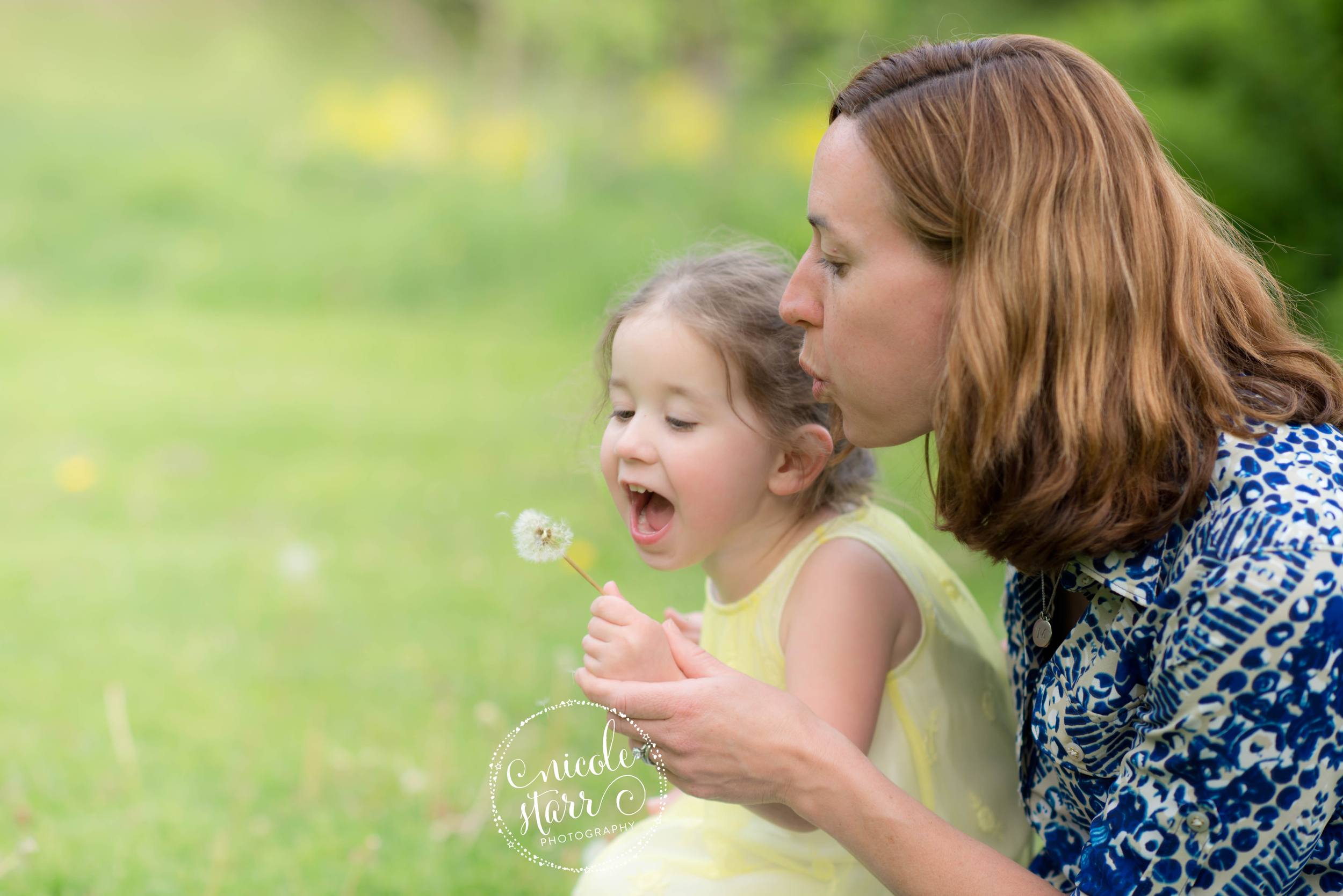 mom and baby dandelion blowing photo