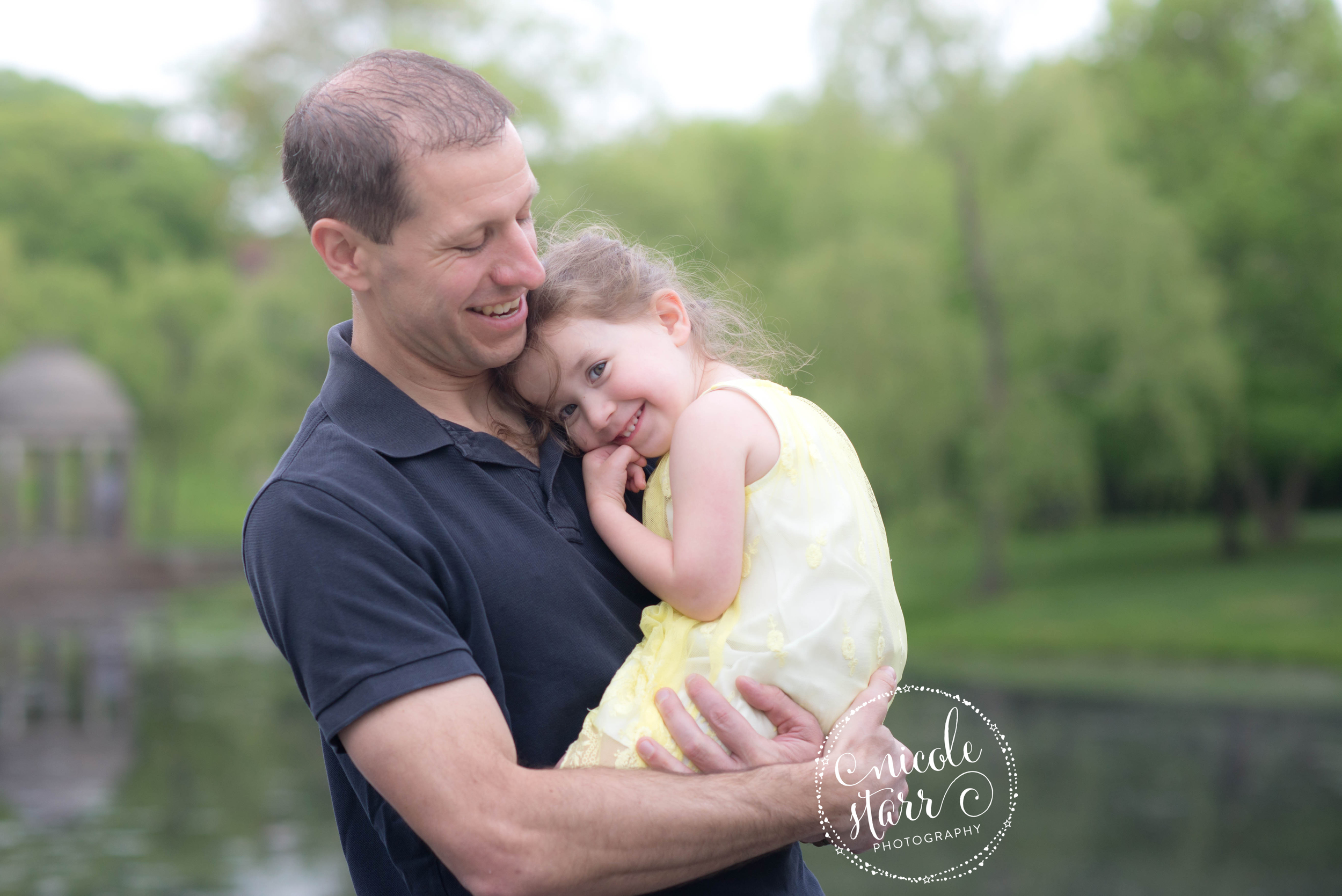 father daughter hugs at brookline park photo