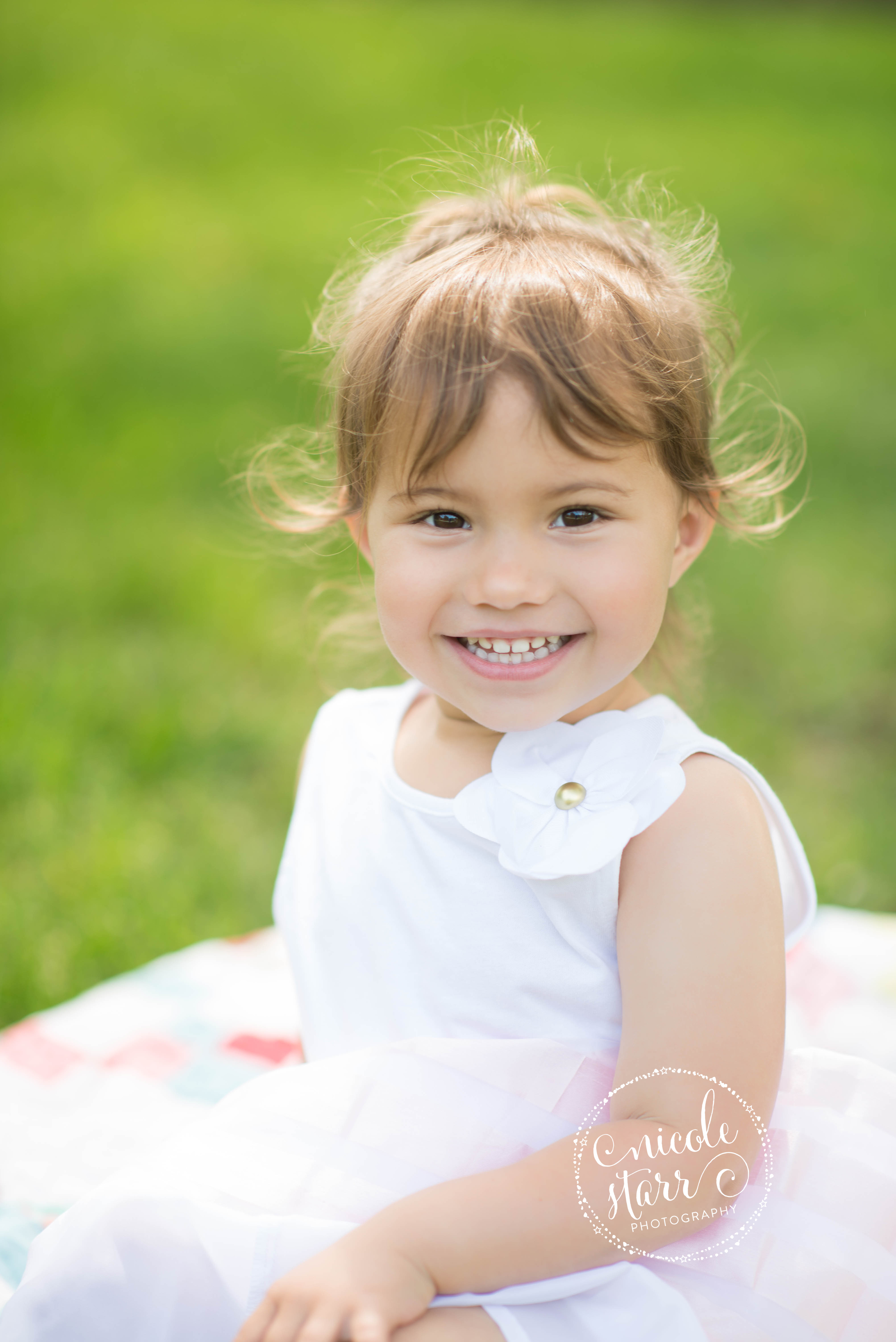pretty toddler in a park for family photos