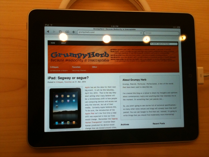 The iPad displays the home page of the GrumpyHerb blog.