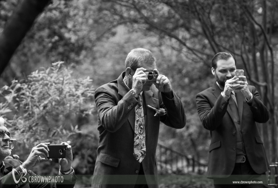 Wedding guests with cell phone cameras