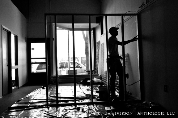 Contractor Joe Franek sets a new partition wall April 9, 2009, at Anthologie's location at 18 Bridge Square, Northfield, Minn.