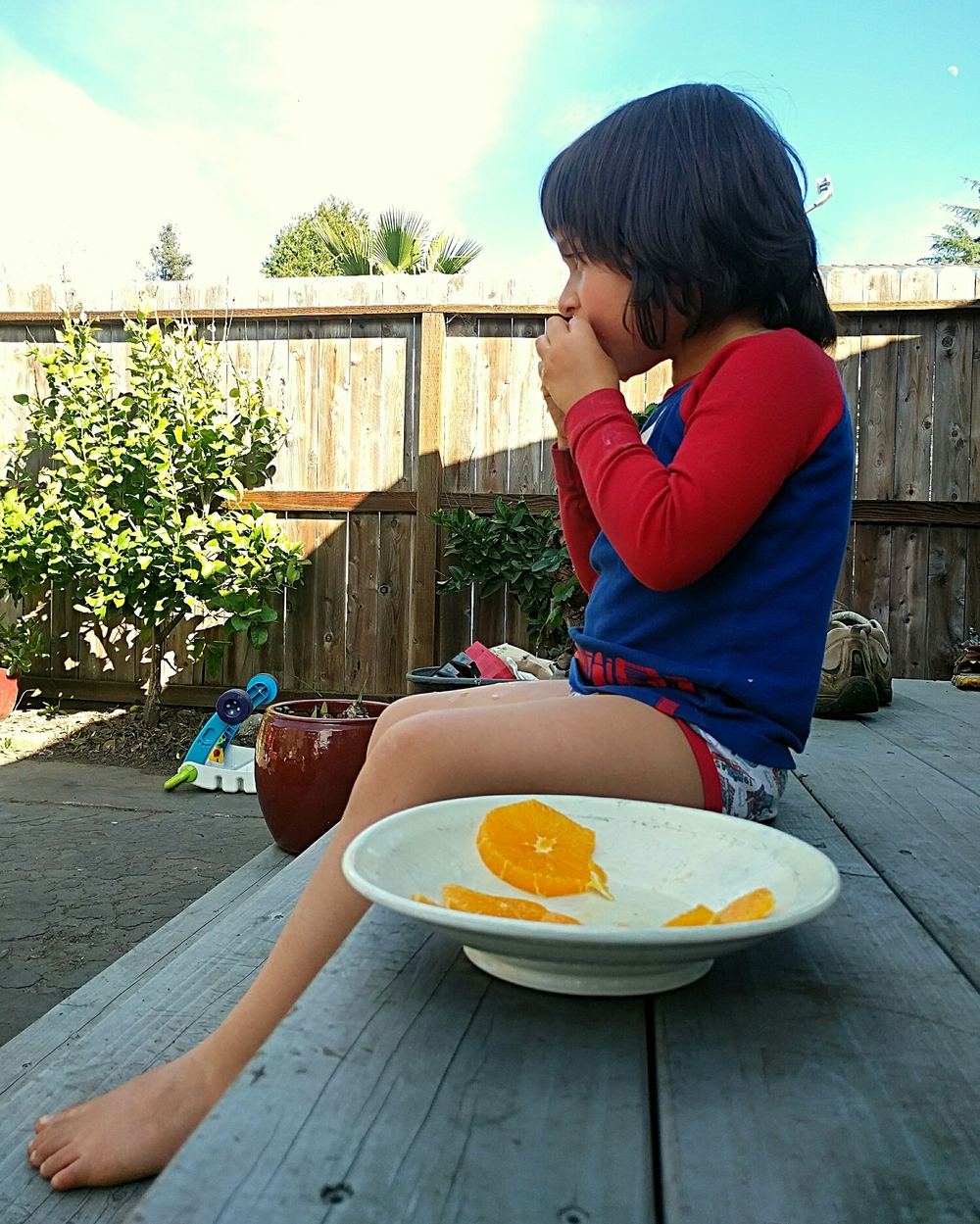 So warm Kamal decided he'd eat his orange outside. In his underpants.
