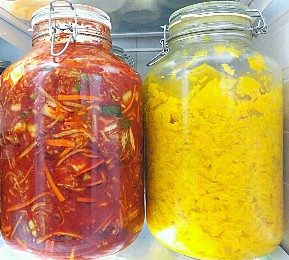 Left to right: Adam's fabulous kimchi; Adam's superyellow pineapple-turmeric sauerkraut