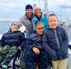 The Shaw family poses on the dock after sailing. 