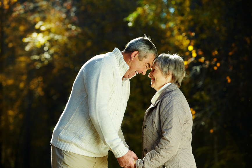 Photo of senior couple in the park in autumn