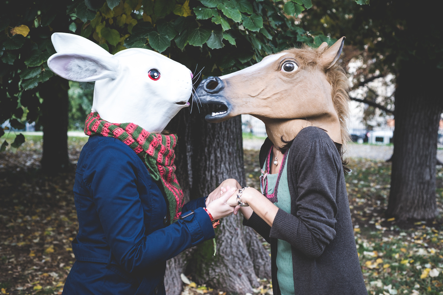 horse and rabbit mask women in the park autumn