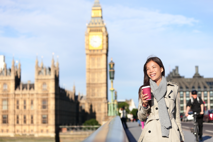 London woman happy by Big Ben