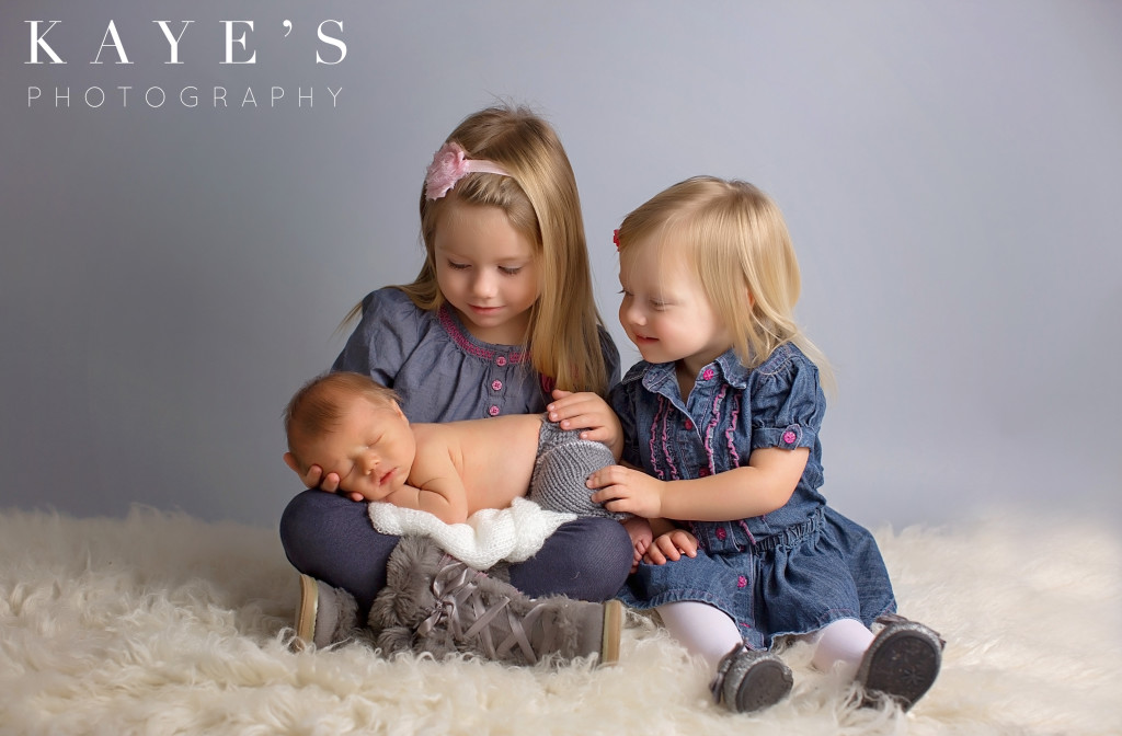 Siblings with newborn, Sisters with brother baby