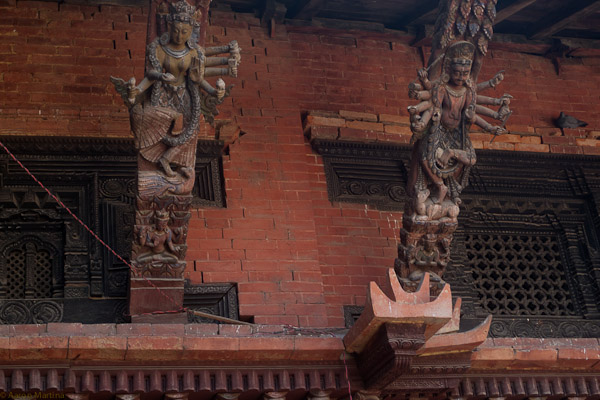 Carvings on supports for the overhang