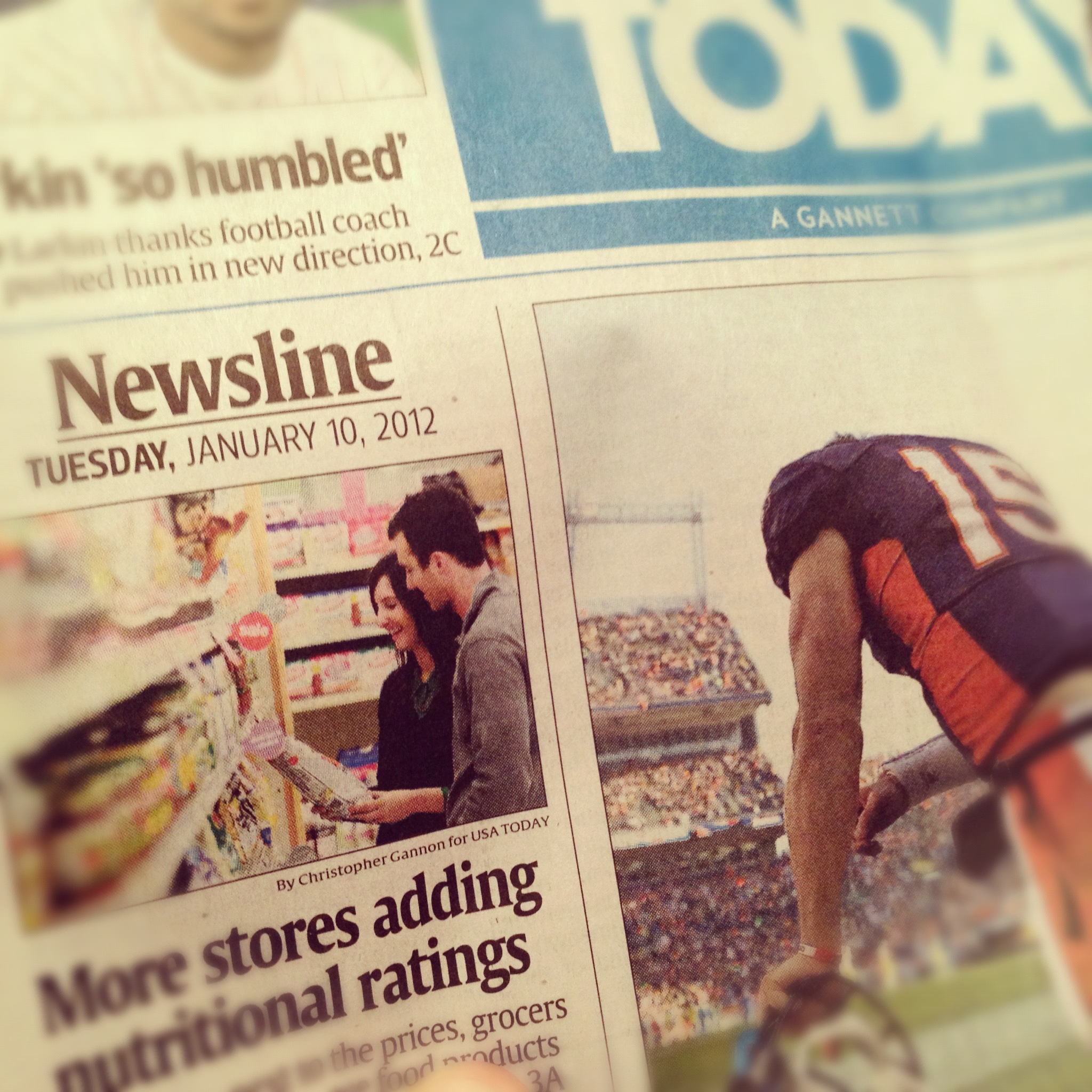 USA Today next to Tim Tebow