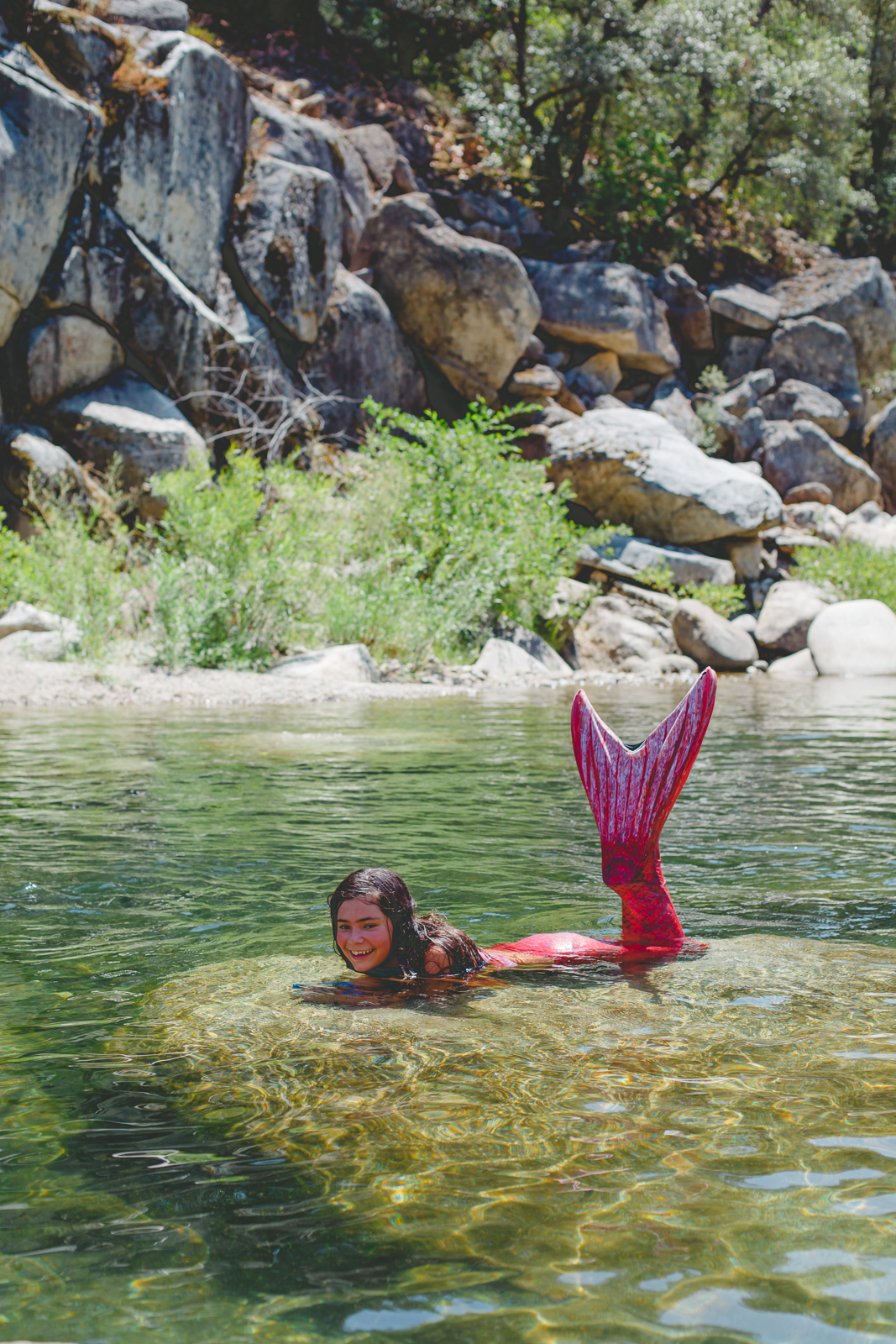 Mermaid in the Yuba River, Nevada City, showing off her Fin Fun Mermaid Tail