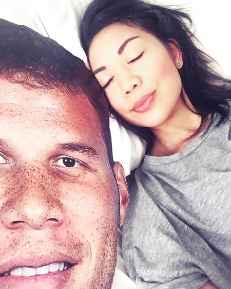 This is me laying peacefully next to a giant cardboard cutout of Blake Griffin.