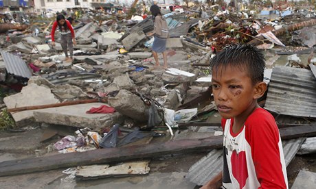 Residents sorting through the wreckage in Tacloban, central Philippines.