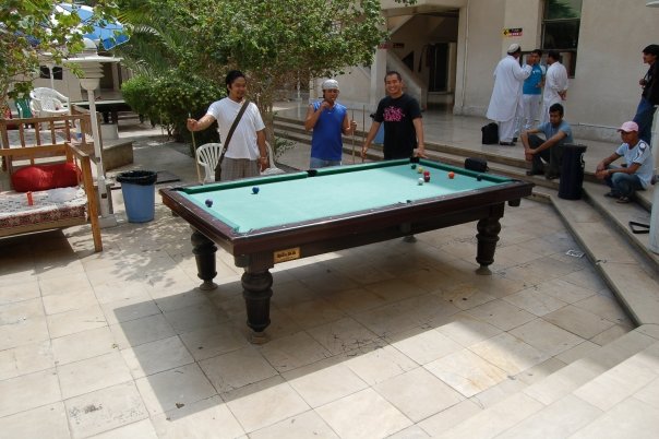 Biding their time at the billiards in the Farabi Hotel.